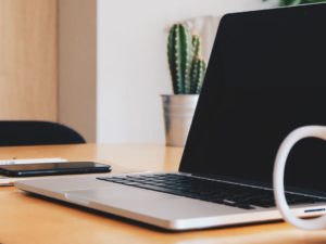 office desk with laptop on it